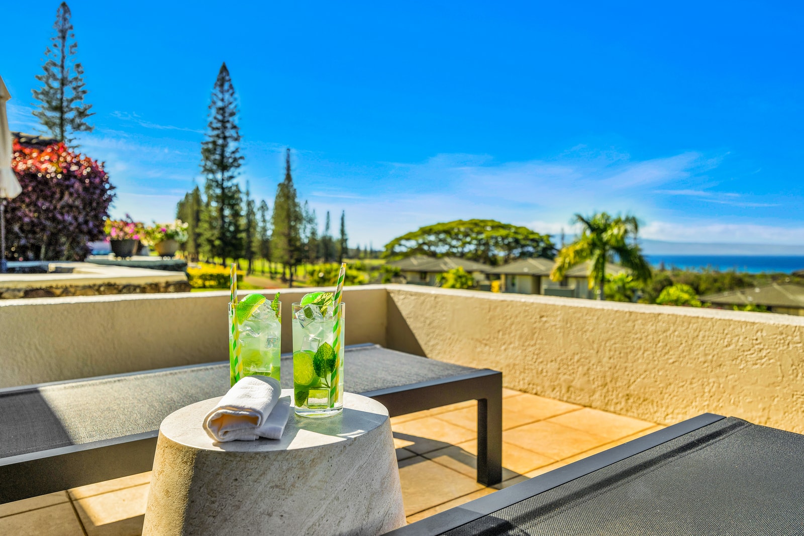 Enjoy cocktails on the lanai with low seating and unobstructed views toward the ocean and treetops. KGV-24P7