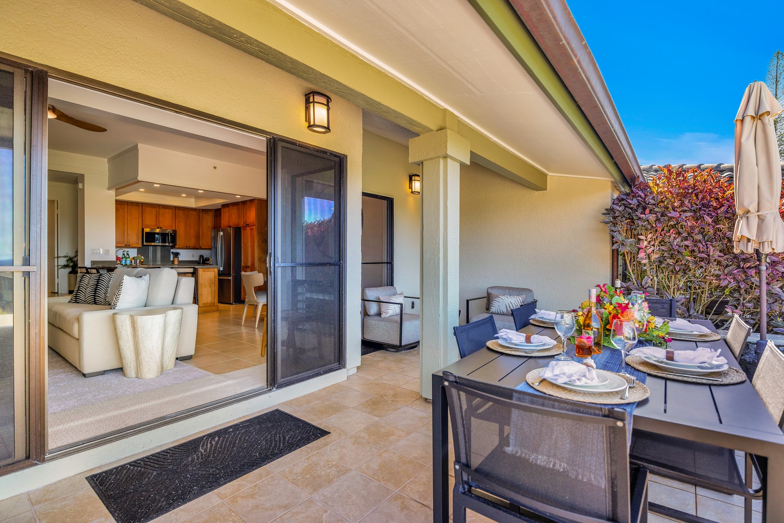 Indoor-outdoor living flows easily from the living area onto the lanai with dining space and resort views. KGV-24P7