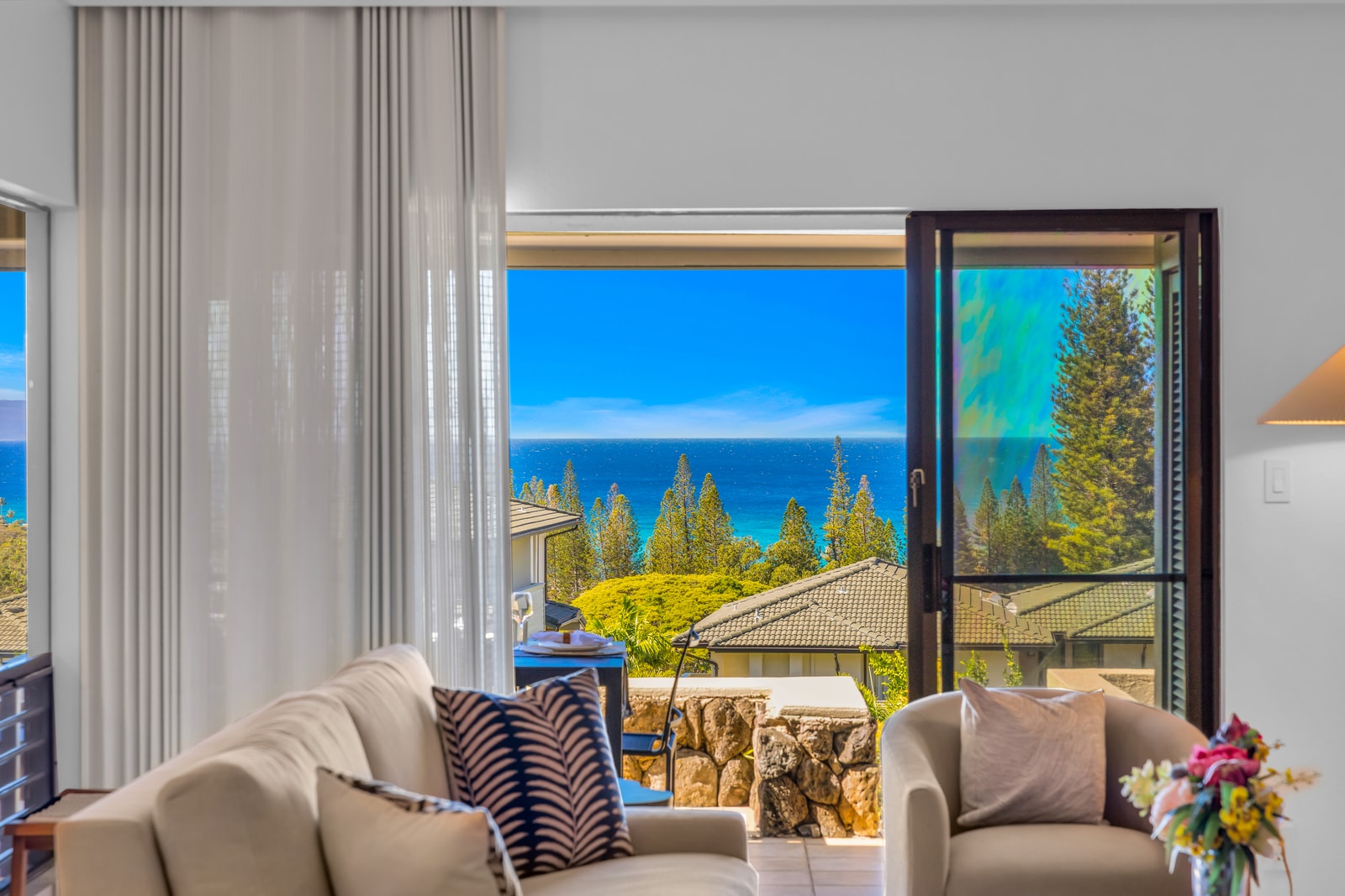 Enjoy natural light and stunning ocean views from the living area with direct access to the lanai. KGV-24P7