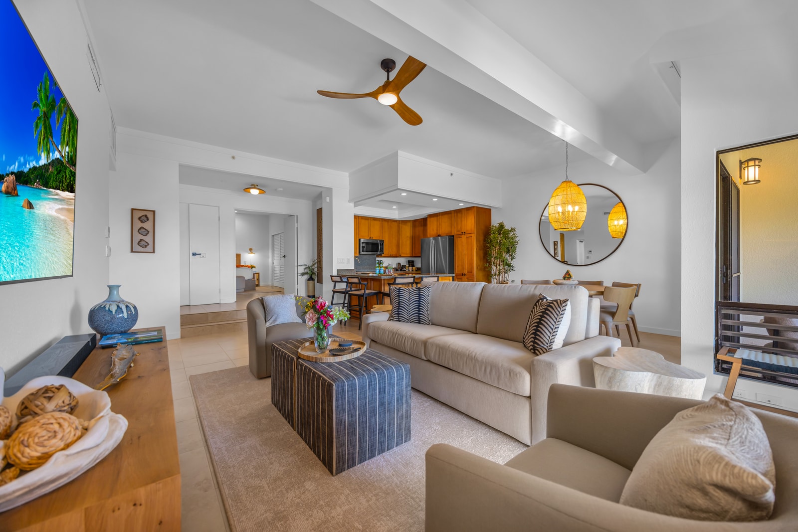 The open living space keeps everyone connected from the kitchen to the lanai. KGV-24P7