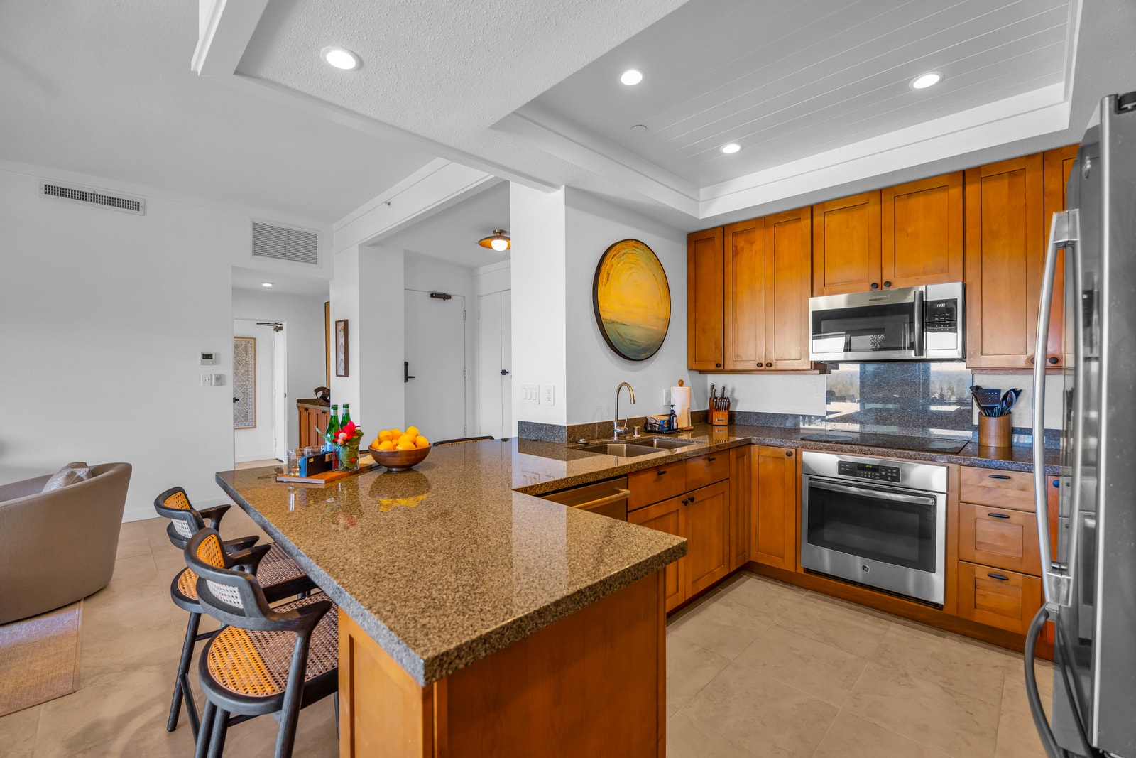 Cook with ease in a spacious kitchen featuring stainless appliances and ample counter space. KGV-24P7