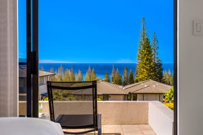 A seating area just outside the primary bedroom captures relaxing ocean views. KGV-24P7