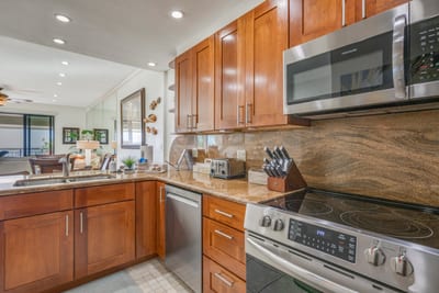 Welcome to your vacation command center—where countertops curve like waves and snacks magically replenish themselves