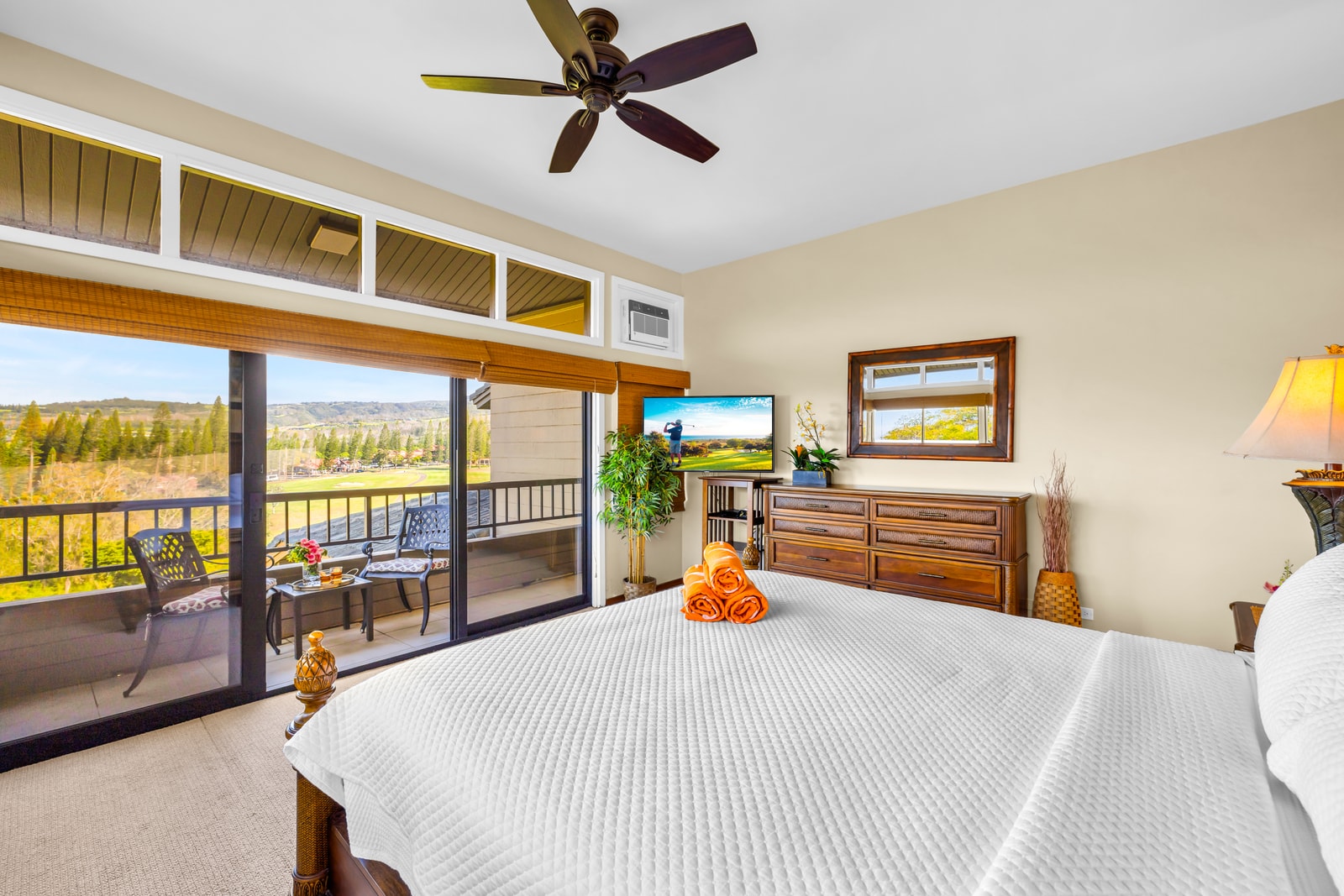 The comfortable primary bedroom is perfect for unwinding after a day exploring Maui