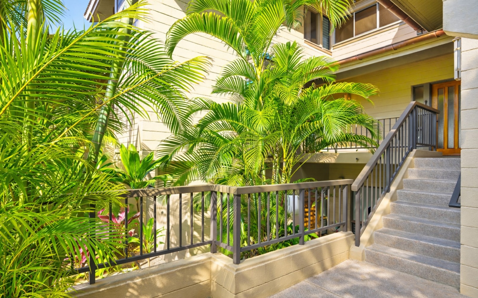 A welcoming entrance surrounded by greenery