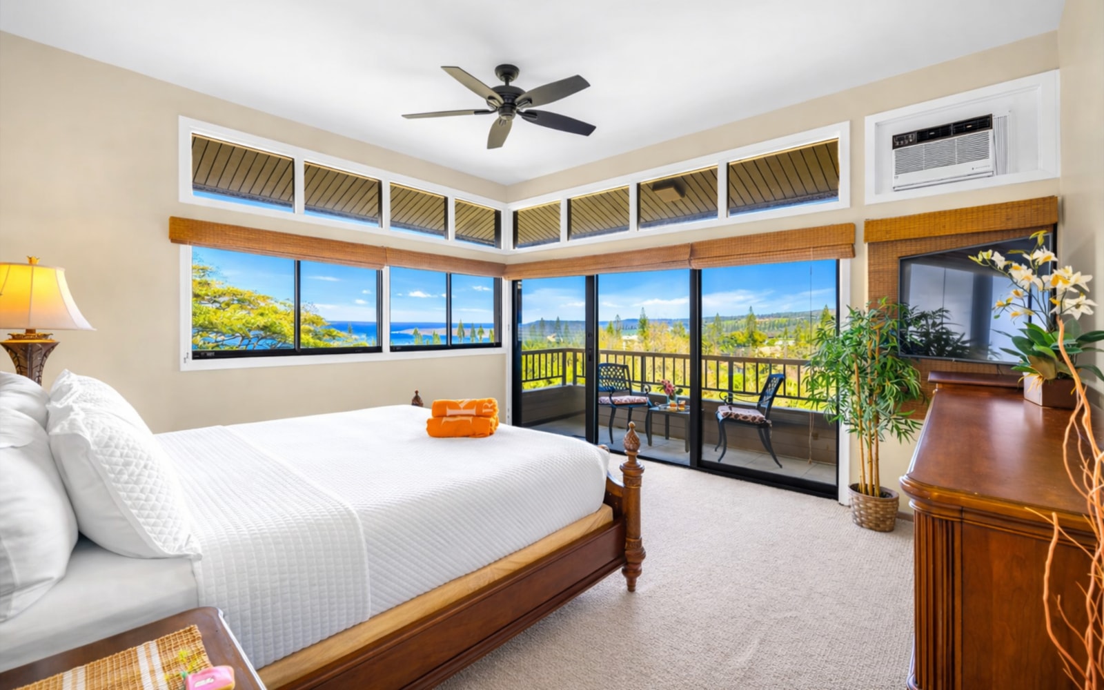 The bedroom features a private lanai and seating area