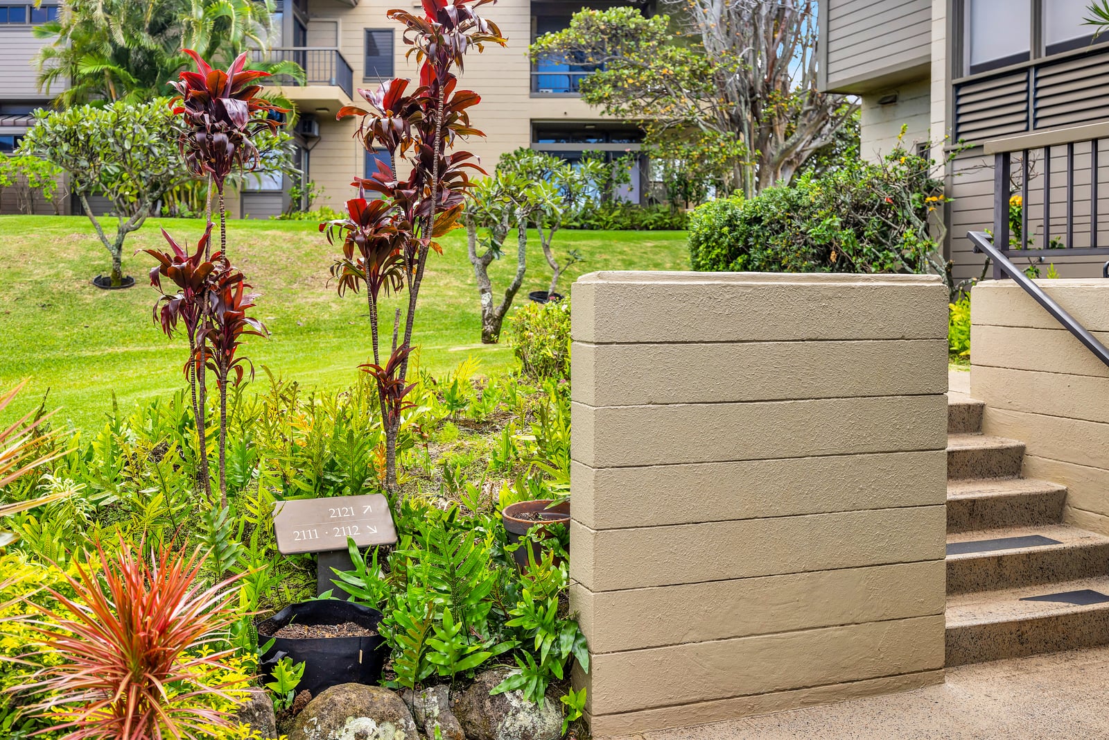 Landscaped paths and tropical flowers welcome you back to your peaceful Maui retreat. KRV-2121