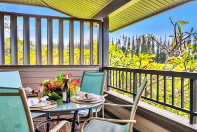 Relax on your private balcony, where distant ocean views and swaying palms set the tone.