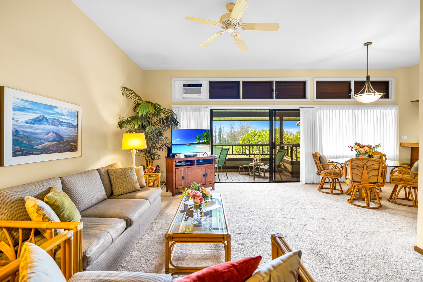 Bright and inviting, the living area offers a comfortable sofa sleeper and easy lanai access. KRV-2121