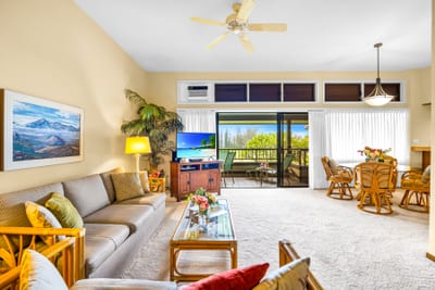 Bright and inviting, the living area offers a comfortable sofa sleeper and easy lanai access.