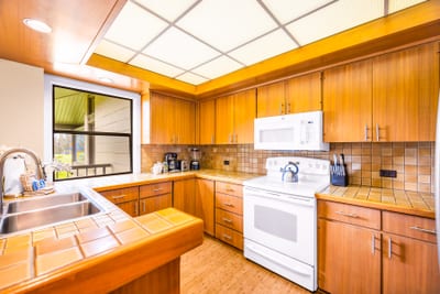 Prepare meals with ease in your open kitchen, fully equipped with granite counters and modern appliances.