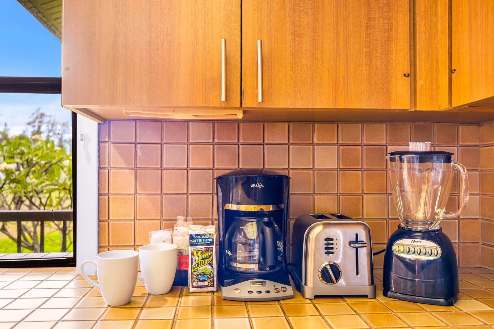 Start your day with fresh-brewed coffee in your well-stocked kitchen setup. Details like a blender, coffee maker, and thoughtful amenities add everyday ease. KRV-2121