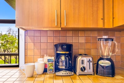 Start your day with fresh-brewed coffee in your well-stocked kitchen setup. Details like a blender, coffee maker, and thoughtful amenities add everyday ease.