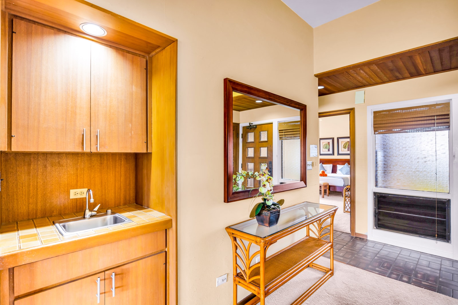 Warm wood finishes and neutral tones create a comfortable welcome just inside the entry. KRV-2121