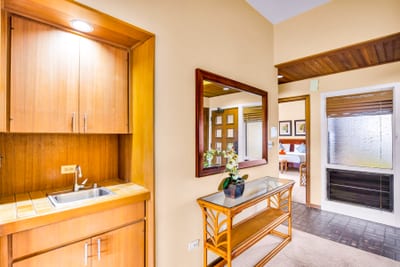 Warm wood finishes and neutral tones create a comfortable welcome just inside the entry.