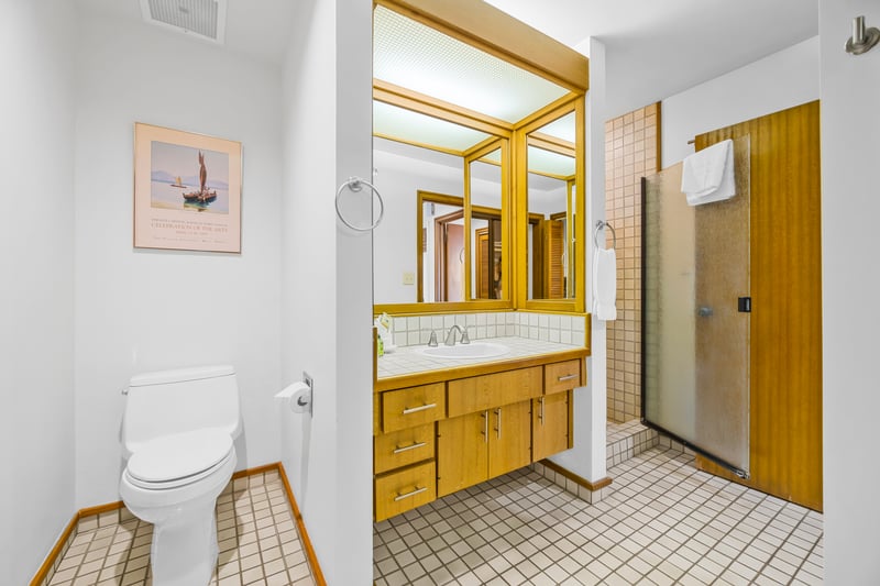 Granite counters and a roomy vanity provide plenty of space to get ready in the primary bath.