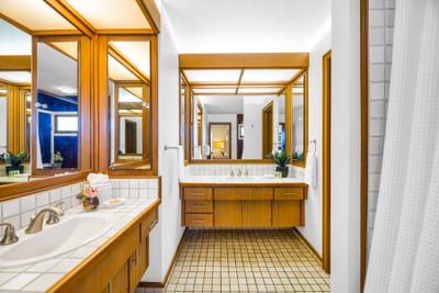 The primary bath offers dual sinks, a soaking tub, and walk-in shower for added comfort and convenience.
