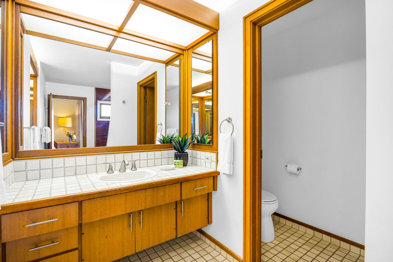 A second full bath with granite counters and shower makes sharing the space feel effortless. KRV-2121
