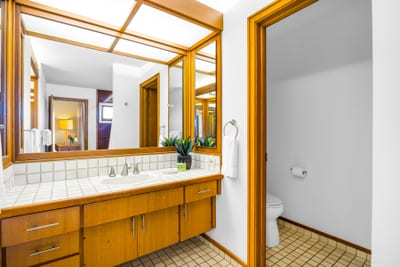 A second full bath with granite counters and shower makes sharing the space feel effortless.