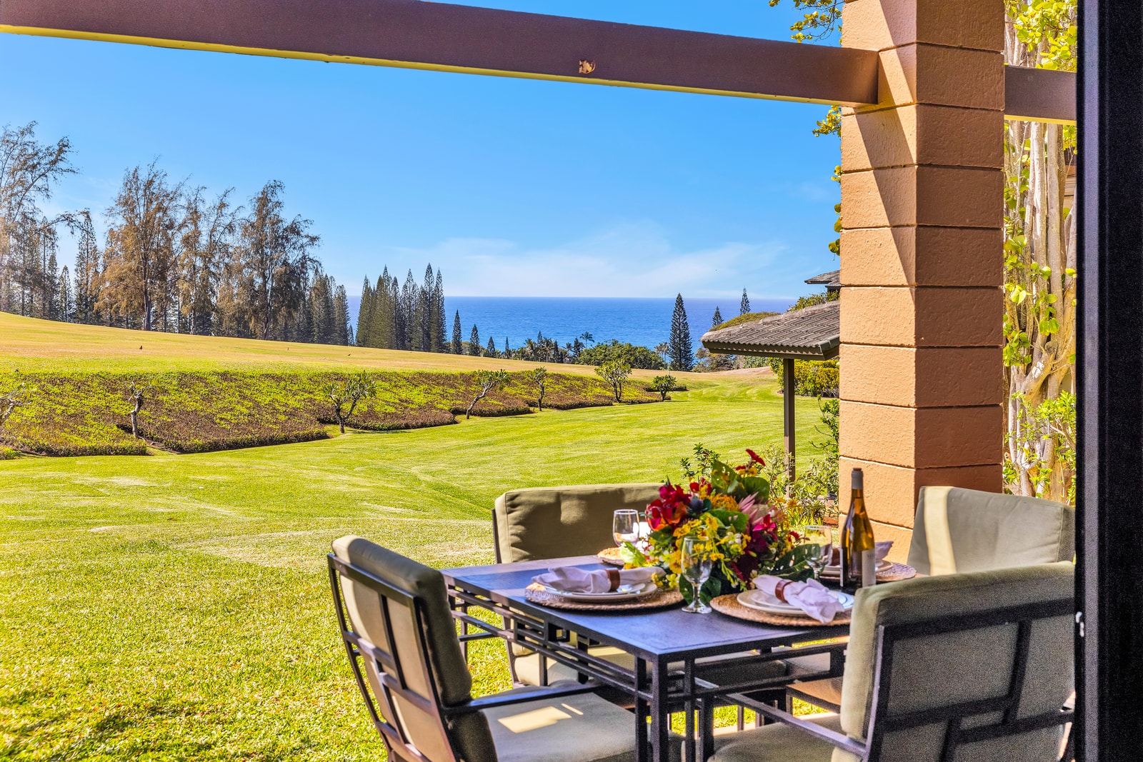 Dine outdoors with glimpses of the ocean and sweeping views of the golf course