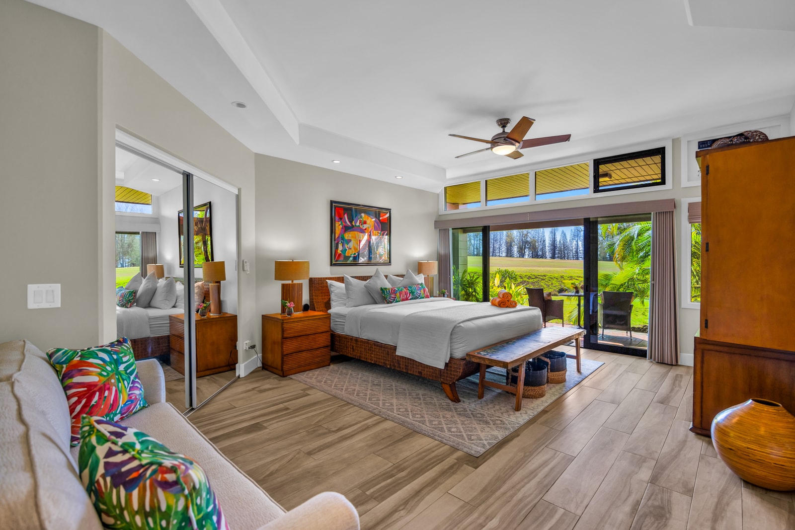 The primary bedroom features a private lanai through sliding glass doors, offering fantastic views of the golf course