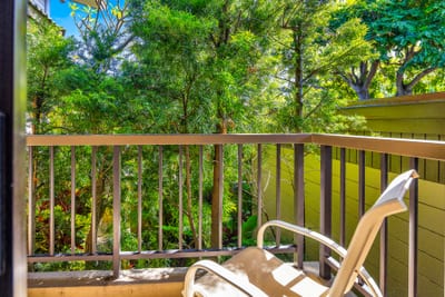 Step outside from the bedroom onto your private balcony for fresh air and tropical green views.