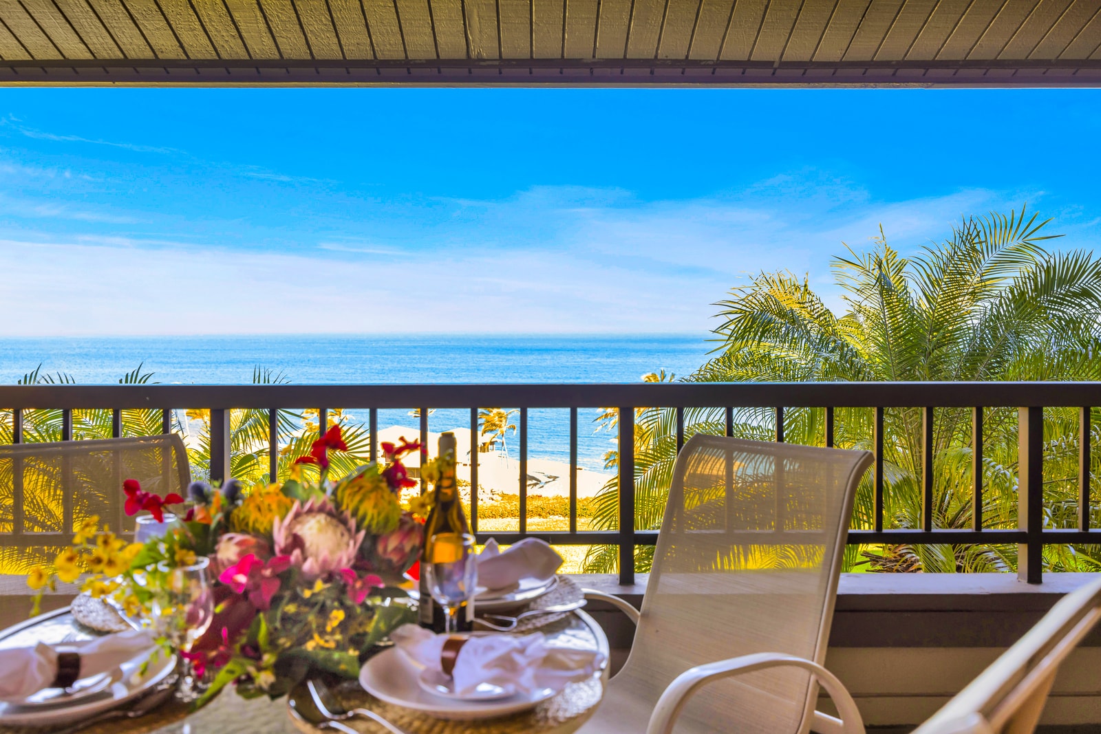 Outdoor meals feel extra special on your shaded balcony with elevated ocean and garden views.