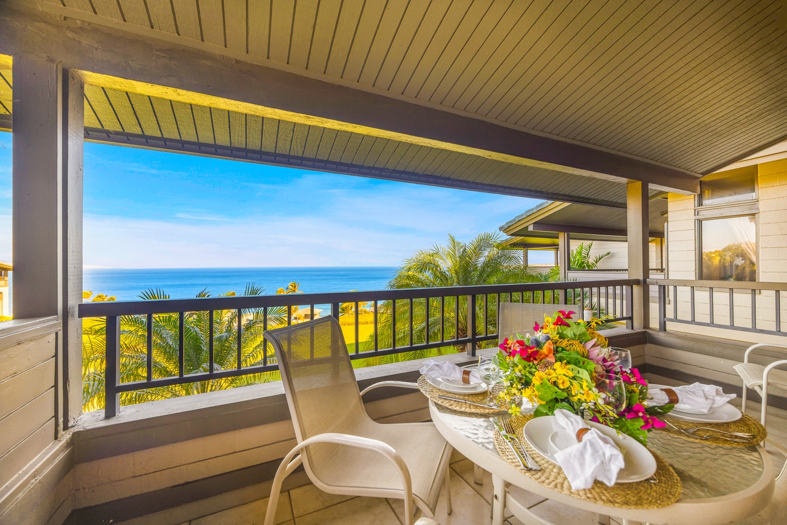 Catch golden hour from your shaded balcony with peekaboo ocean views and tropical surroundings.
