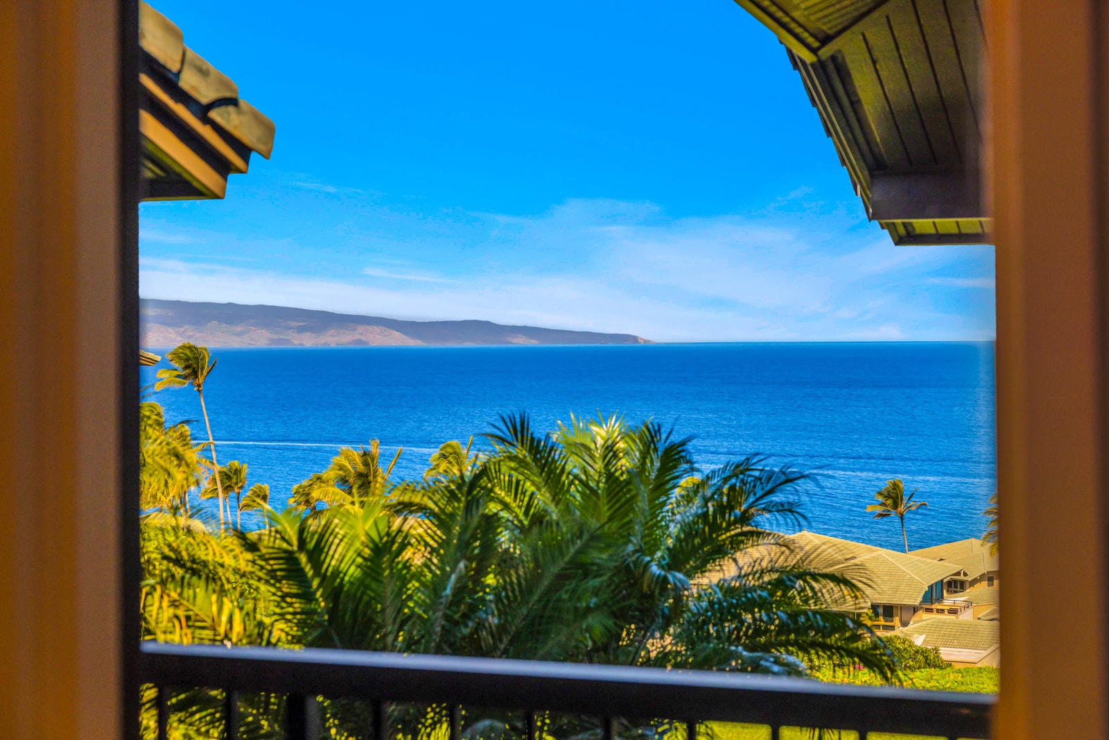 Wake up to treetop views and glimpses of the ocean right from your balcony.