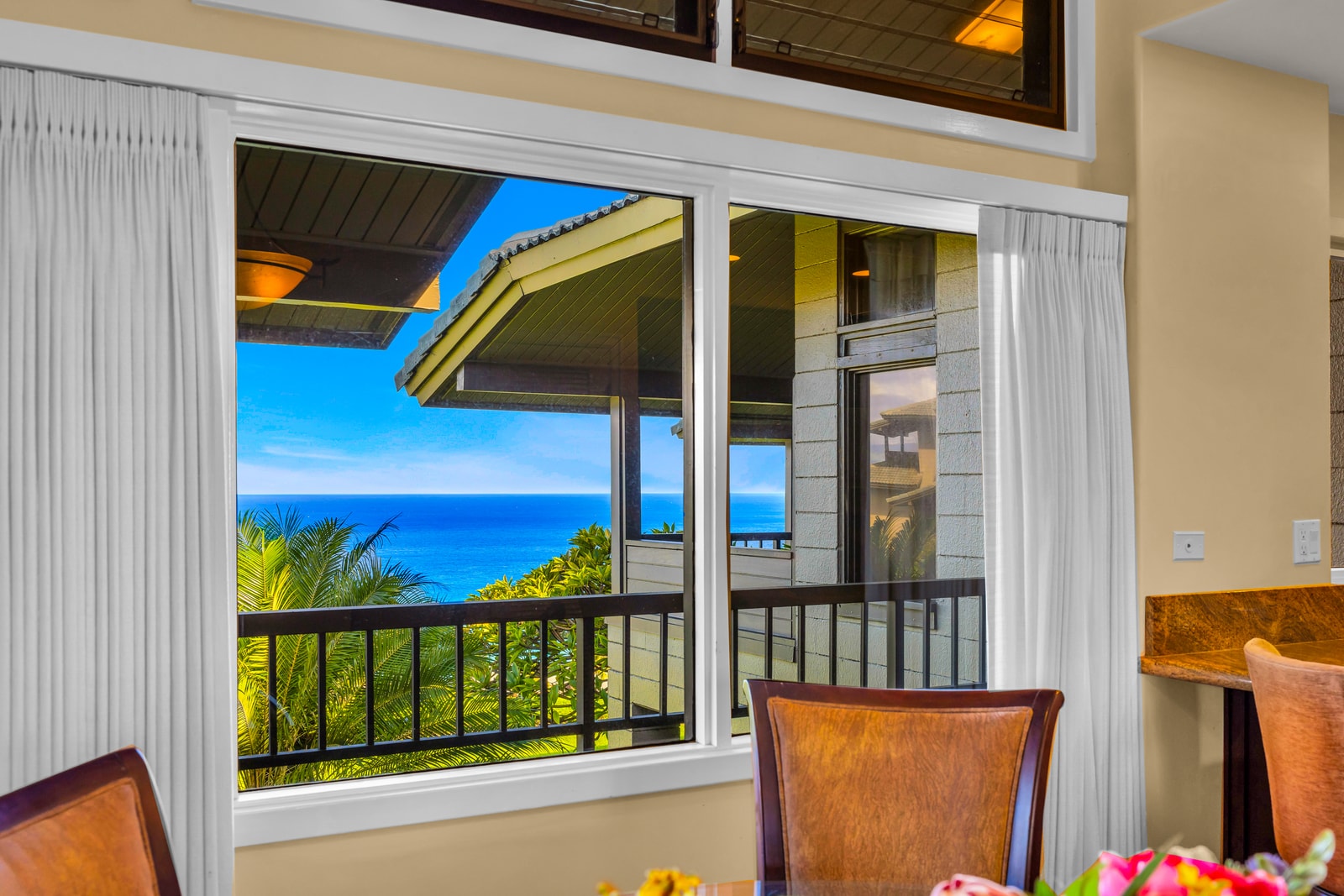 This bright dining nook brings the outdoors in, with garden views and tropical light.
