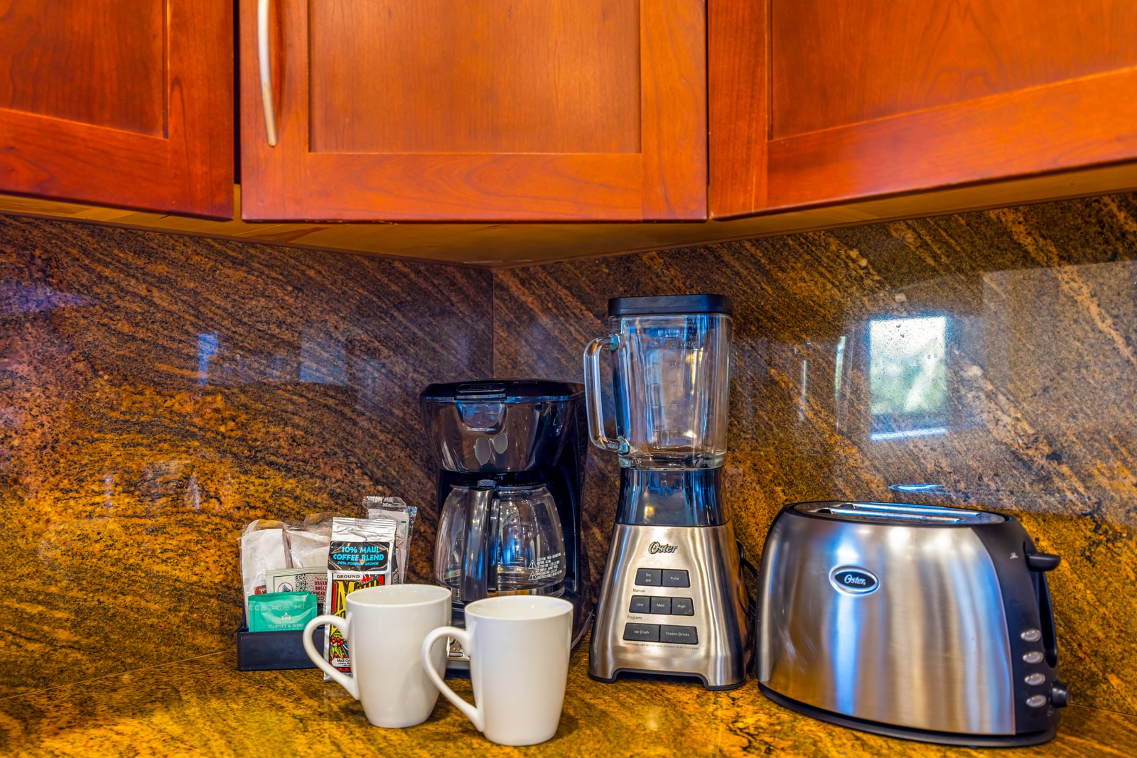 Wake up to fresh coffee with everything you need, from mugs to grinder, right on the granite counter.
