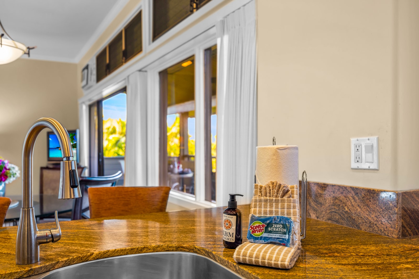 The kitchen opens to the living area, keeping meals and conversation flowing effortlessly.