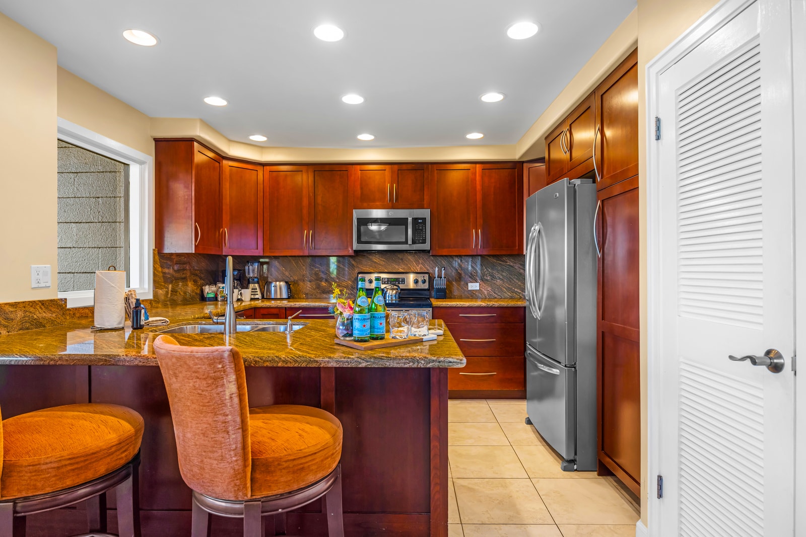 Whether you're prepping a meal or enjoying a snack, this kitchen offers space, light, and comfort.