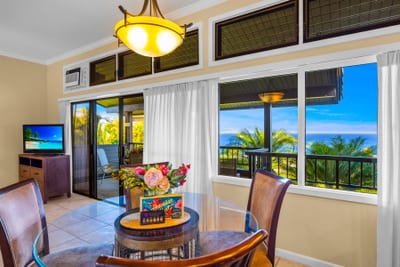 Host a sunset dinner or quick bite in this corner dining area that connects seamlessly to the living room.