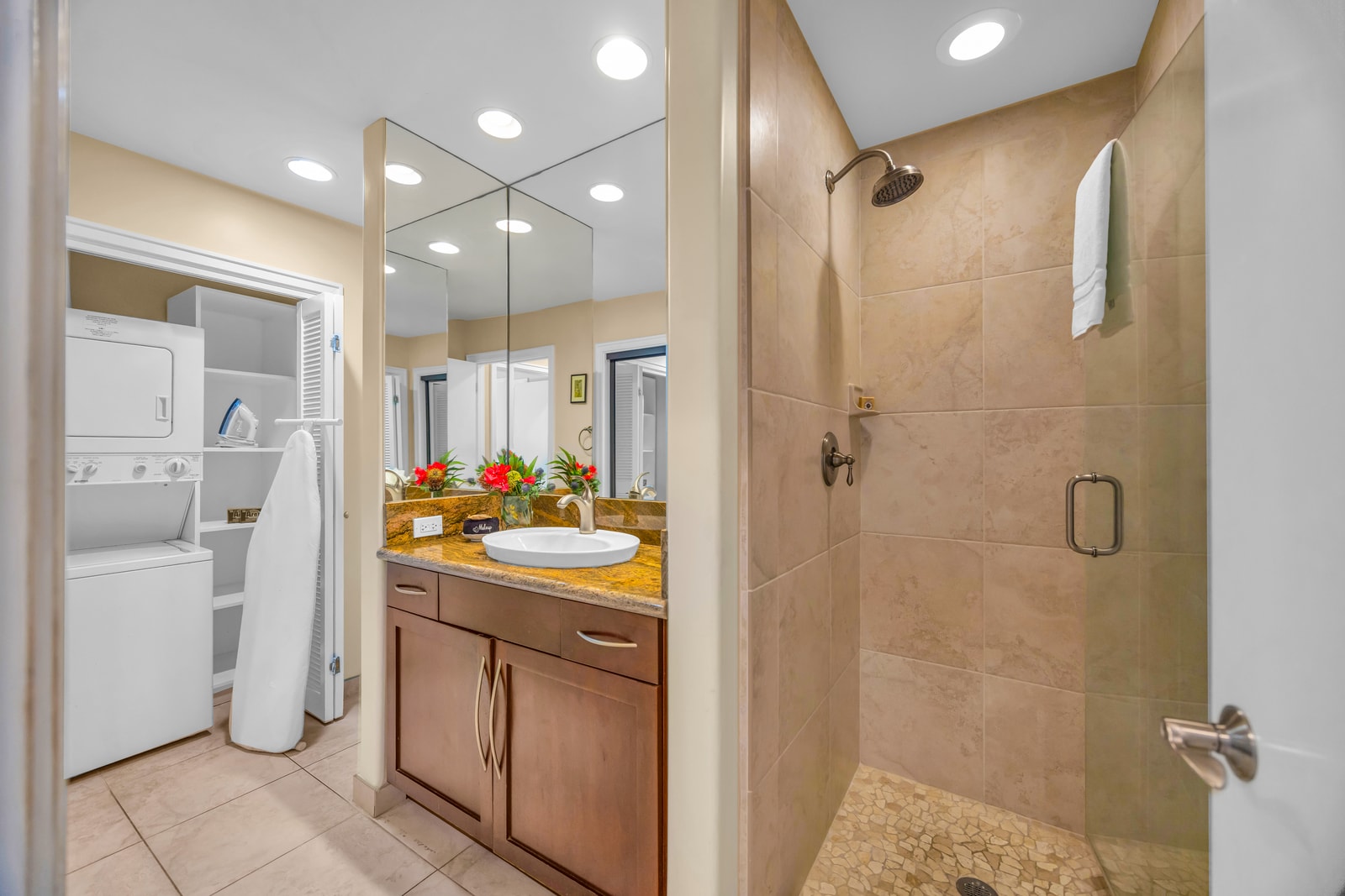 The second bath features a full walk-in shower and access to the laundry closet.