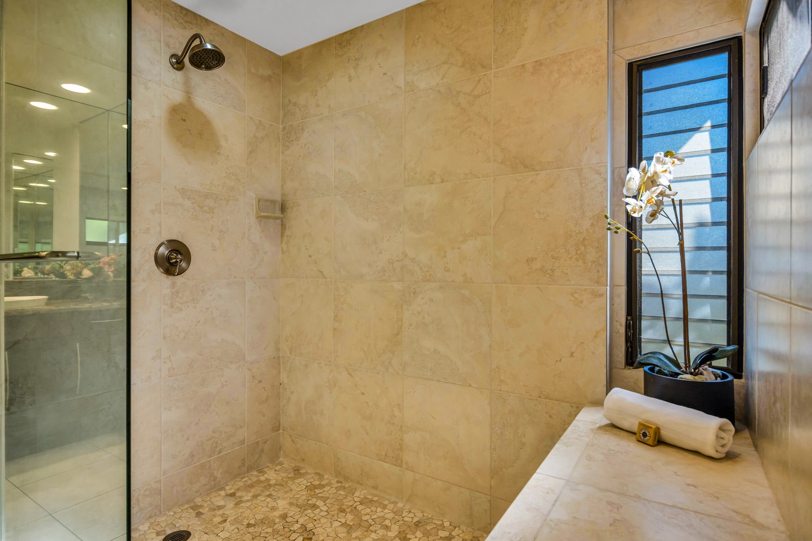 Rinse off in the second bath’s tiled walk-in shower, perfect for guests or extra space.