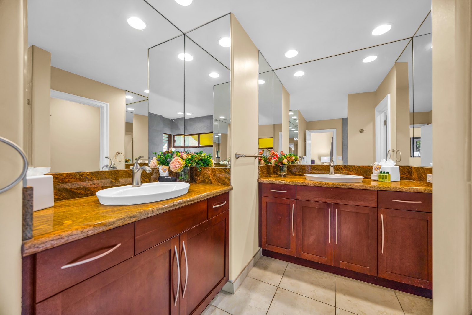 Your ensuite bath features dual vanities, granite counters, and plenty of lighting for getting ready.