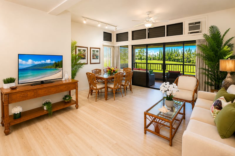Living area with smart TV, sofa and fairway views