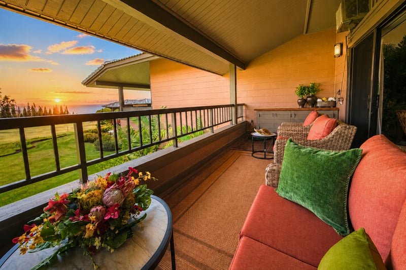 Golden sunset from the lanai over fairways and ocean