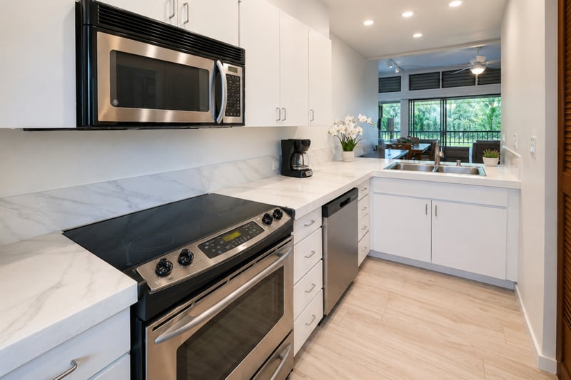 Full kitchen with stainless appliances and stone counters