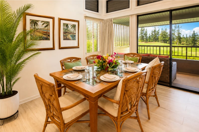 Glass-top dining for six beside the golf-view lanai
