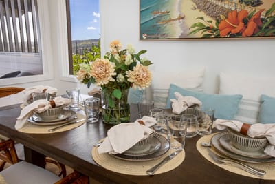 Gather ‘round the table where the flowers are always fresh, the napkins always folded, and the ocean always near KRV-2823