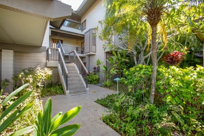 Ease into vacation mode as you walk past sunlit palms and vibrant island plants toward your serene upstairs retreat KRV-2823
