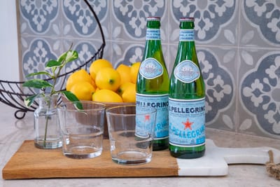Start your mornings with sparkling San Pellegrino and fresh lemons, thoughtfully arranged for your refreshment KRV-2823