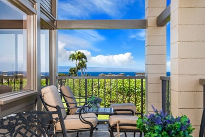 Cozy coastal seating with stunning ocean views and tropical charm.