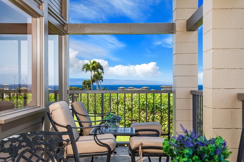 Cozy coastal seating with stunning ocean views and tropical charm.