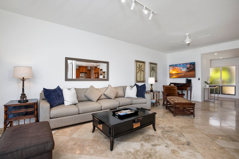 Stylish coastal living room with tropical accents and entertainment-ready layout.
