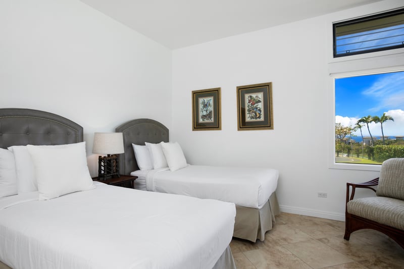 This guest room feels like a breath of fresh air — cool, calm, and kissed by breezes and views of paradise