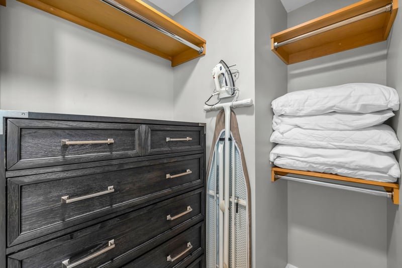 The closet features ample space and an iron and ironing board KRV-311