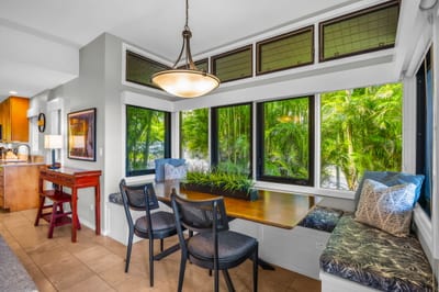 The breakfast nook features comfortable seating and foliage views KRV-311